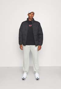 YOURTURN by Zalando - UNISEX - Winter jacket - black Thumbnail Image 1