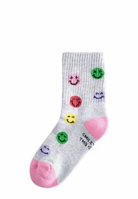 Calze grigie a costine con fantasie di faccine sorridenti in rosa, verde, giallo, rosso e viola, con punte e talloni rosa.