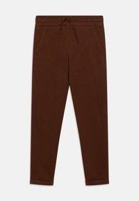 Pantalons de jogging marron en tissu doux, avec une taille élastique et un cordon de serrage, des poches latérales et des ourlets côtelés.
