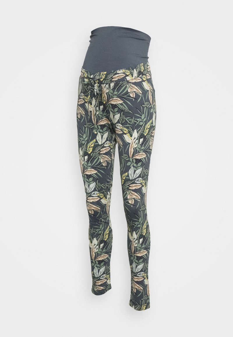 Těhotenské legíny s tmavě modrým páskem. Tkanina má listový vzor v zelených a béžových tónech na tmavém pozadí.