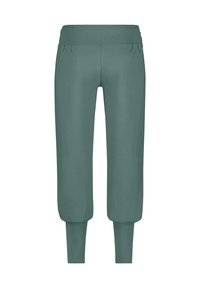 Grüne Sweatpants mit einem gerafften Bund und zwei vorderen Taschen. Schmal zulaufende Knöchel mit glatter Textur. Lässiges Design und bequemer Schnitt.