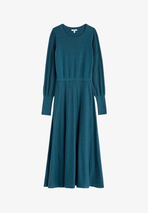 Abito lavorato a maglia in turchese con maniche lunghe a sbuffo caratterizzate da una texture a coste. Corpino aderente e gonna svasata. Collo tondo e lunghezza fino al polpaccio.