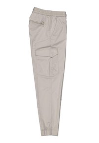Beige Cargo-Hosen mit elastischem Bund, seitlichem Reißverschluss und aufgesetzten Taschen, taillierter Schnitt und glatter Stoffstruktur.
