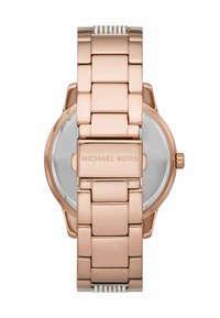 Rosegold-Uhren aus Edelstahl mit einem Gliederarmband-Design, runder Gehäuseform und einer Markenprägung auf der Rückseite. Klare Glasoberfläche.