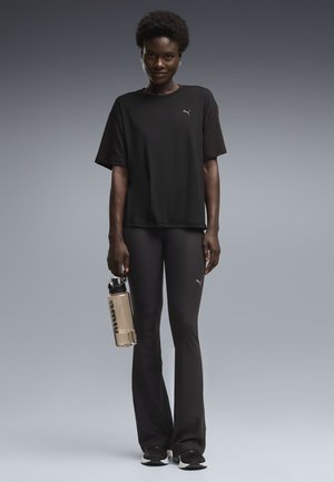 Puma, W CLOUDSPUN FLARE TIGHT - Leggings - black