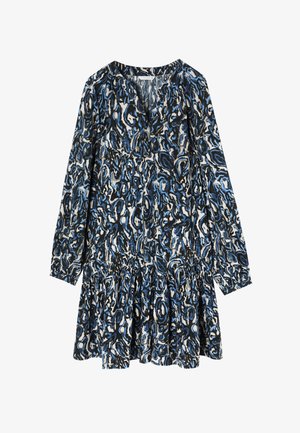 Manska obleka z dolgimi rokavi in V-izrezom, ki ima modro, črno in belo zvijajoč vzorec ter nabran pas za širšo silhueto.