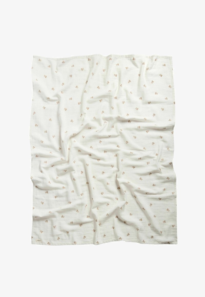 White fabric cloth with small beige teddy bear prints, slightly wrinkled, laid flat against a white background.
