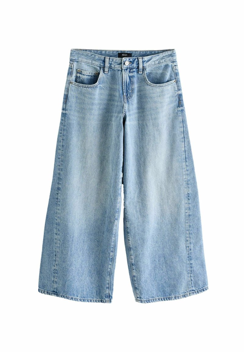 Jeans culotte in denim azzurro chiaro con gambe larghe, cinque tasche e zip frontale. Presentano una leggera scoloritura e un taglio dritto all'orlo.