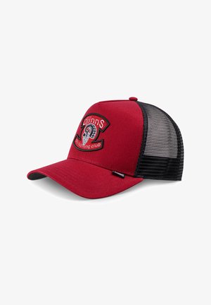 Red and black mesh trucker cap with an octopus tentacle patch and "djinns do nothing club" text on the front panel.