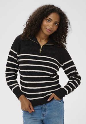 Schwarz-weißer gestreifter Pullover mit Reißverschlusskragen, gerippter Textur und langen Ärmeln. Verfügt über einen goldenen Reißverschlussakzent und eng anliegende Bündchen.