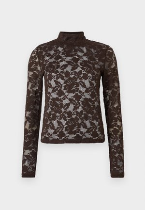 Top en dentelle marron avec des manches longues et un col montant. Motif floral, texture transparente et silhouette cintrée. Bords lisses à l'ourlet et aux poignets.