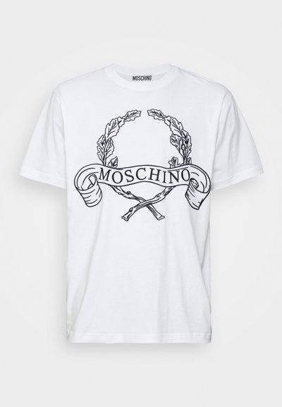 T-shirt en coton blanc avec un design graphique noir représentant une couronne de laurier et le script "MOSCHINO", à manches courtes et col rond.