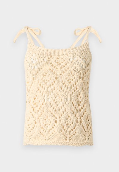 Λευκό εκρού πλεκτό τοπ χωρίς μανίκια με σχέδιο από διαμάντια σε δαντέλα και ρυθμιζόμενους δεσίμους στους ώμους, με κυματιστό τελείωμα.