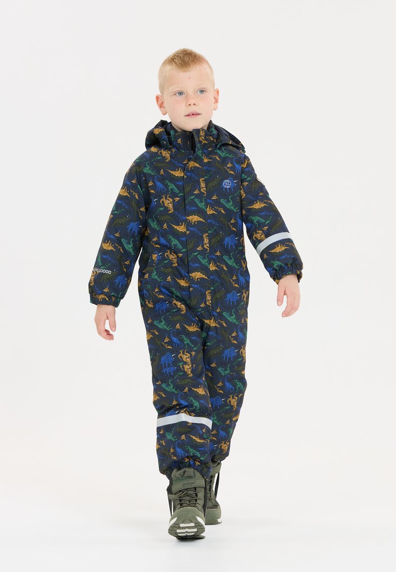 Eén-delig regenpak voor kinderen in zwart met een kleurrijk dinosaurussenpatroon. Voorzien van een capuchon, elastische manchetten en reflecterende accenten.