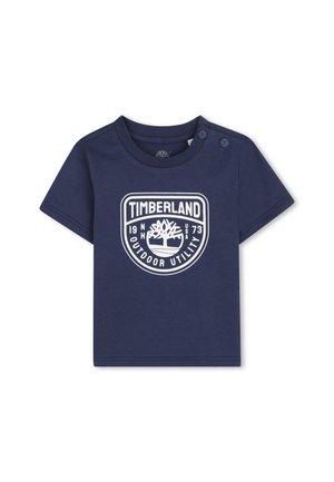 Marineblaues Kleinkind-T-Shirt mit Timberland-Logo und dem Text "Outdoor Utility", ausgestattet mit zwei Knöpfen auf der linken Schulter für einfaches An- und Ausziehen.
