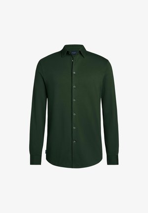Chemise à manches longues boutonnée vert foncé, fabriquée dans un tissu lisse, dotée d'un col classique, de boutons à l'avant et d'un ourlet arrondi.