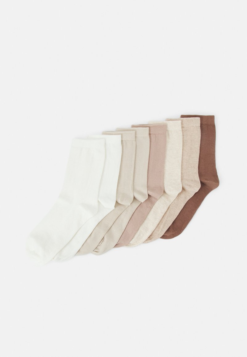 Set med åtta par strumpor i olika nyanser från vitt till mörkbrunt. Tillverkade av mjukt material med standardpassform och ribbade manschetter.