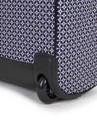Rolling suitcase with geometric black, white, and blue pattern. Features a sturdy black base and smooth, rotating wheels for easy maneuverability.
