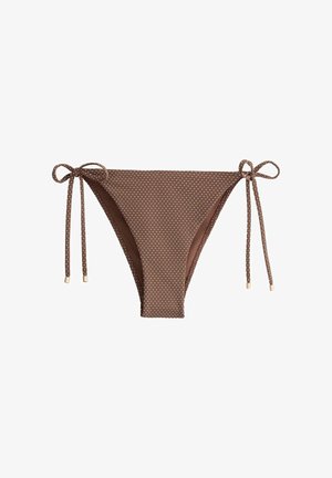 Bas de bikini marron à pois blancs, avec des cordons ajustables de chaque côté ornés de petites embouts métalliques.