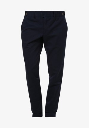 Pantalon bleu marine slim fit pour homme, avec passants de ceinture, fermeture par boutons à la taille, et une apparence propre et ajustée.