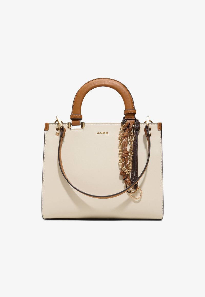Cream rectangular handbag with tan leather handles, detachable shoulder strap, and decorative gold chain and fabric accents.