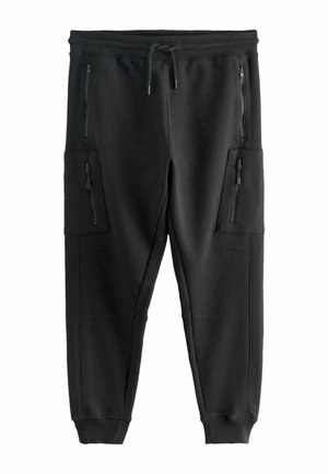 Schwarze Jogginghosen aus weichem Stoff mit elastischem Bund, verstellbarem Kordelzug und mehreren Reißverschlusstaschen zur Aufbewahrung.