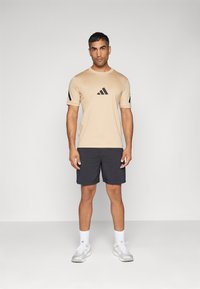 adidas Sportswear Potiskana majica - magic beige