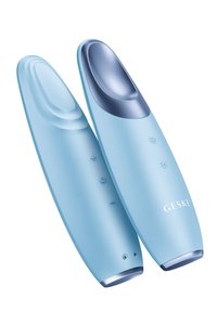 Appareil facial bleu avec une texture lisse, des bords arrondis et un dessus bleu plus foncé. Présente des boutons et des indicateurs LED sur un côté.