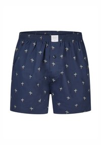 Mørkeblå boxershorts med et palmetræsmønster. Fremstillet af let stof, med elastisk linning og en knaplukning foran.