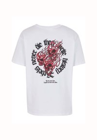 White cotton t-shirt featuring a red and black skull design with flames, and text in curved, bold lettering on the back. Short sleeves, crew neck.