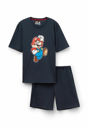 Dunkelblaues Baumwoll-Schlafset mit einem T-Shirt mit kurzen Ärmeln, das ein auffälliges Grafikmotiv eines Cartoon-Charakters zeigt, sowie passenden Shorts mit elastischem Bund.