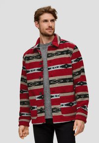 Red and gray patterned jacket with a notched collar and button closure, featuring black and gray stripes and two front pockets.