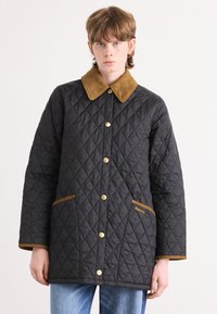 Quilted black jacket with a brown suede collar, gold snap buttons, and two front pockets with brown trim. Features diamond pattern.