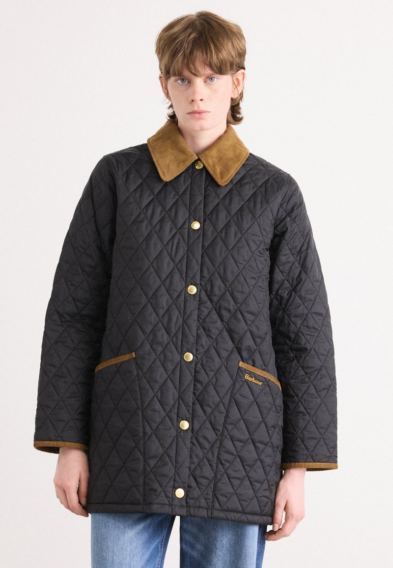 Quilted black jacket with a brown suede collar, gold snap buttons, and two front pockets with brown trim. Features diamond pattern.