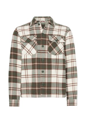 Langermet skjorte med knappestolpe i grønn, brun og hvit rutete mønster, to brystlommer med knappelokk og spiss krage.