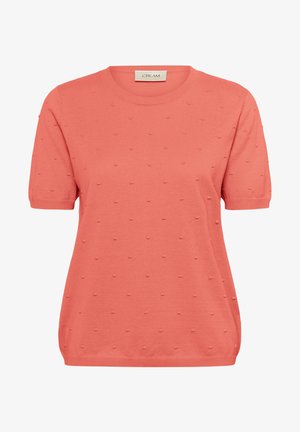 Haut en tricot corail à manches courtes avec un col rond et un motif à pois texturé, offrant une coupe décontractée et une finition en tissu doux.