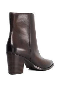 Brown leather ankle boot with stacked block heel, smooth finish, and side stitching, photographed on white background.