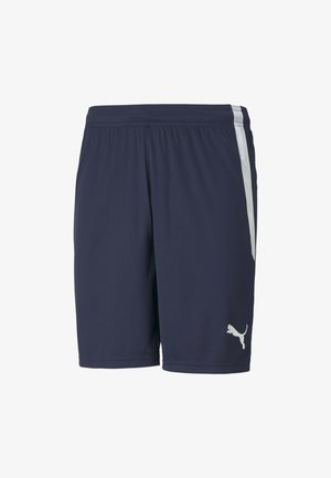 Pantaloni da ginnastica navy in tessuto leggero. Presentano una striscia bianca sui lati e un piccolo logo Puma bianco vicino all'orlo. Vita elasticizzata.