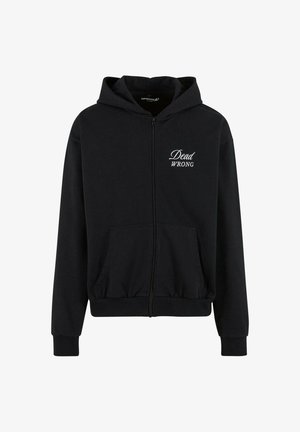 Juodas zip-up džemperis su priekine kišene. Kairėje krūtinės dalyje yra balta užrašas "Dead WRONG". Minkšta medžiaga, laisvas sijonas.