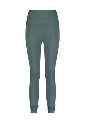 Hochtaillierte, lang geschnittene, dunkelgrüne Leggings ohne sichtbare Muster, mit leichtem Stoffraff in der Knöchelzone.