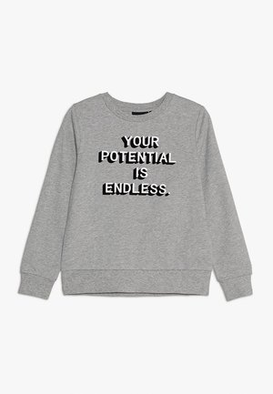Sweat-shirt gris clair à manches longues avec col ras du cou, présentant un texte noir et blanc "VOTRE POTENTIEL EST ILLIMITÉ" centré à l'avant.