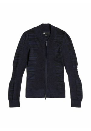 Marineblauwe cardigan met ritsluiting, geribd en met een textuur in het lichaam, verlengde mouwen en subtiele horizontale strepen. Gladde gebreide stof.