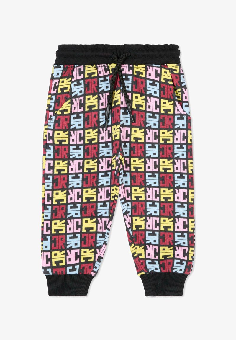 Pantalon de survêtement multicolore avec une taille élastique noire, ornés d'un imprimé géométrique audacieux et répétitif en rouge, jaune, rose et bleu.