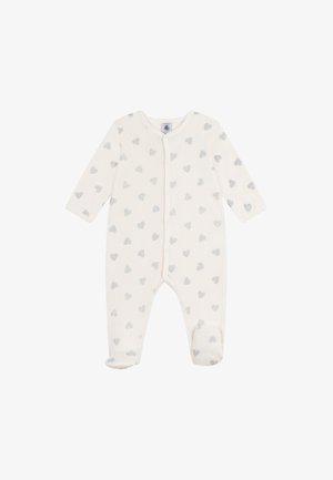 Lichtbeige baby jumpsuit met lange mouwen, met voetjes en verspreide zilveren hartpatronen. Bevat een drukknopen sluiting aan de voorkant.