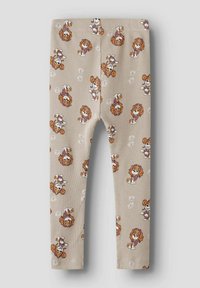 Beżowe prążkowane legginsy z powtarzającym się wzorem kreskówkowego psa i kwiatów. Materiał wydaje się miękki, dopasowany krój z elastycznym pasem.