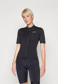 Svart cykeltröja med kort ärm, zip fram, figurnära design, lättviktsmaterial och en liten vit GripGrab-logotyp på bröstet.
