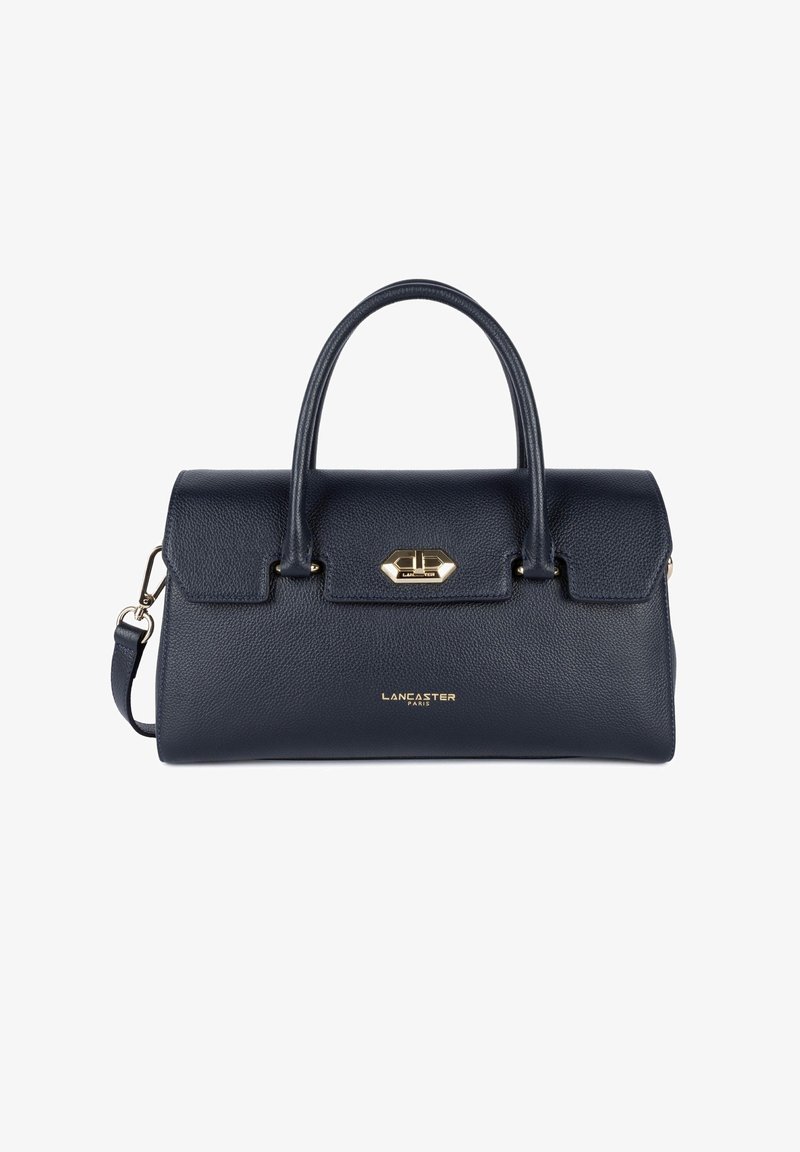 Borsa in pelle blu navy con doppi manici, forma strutturata, hardware in metallo e logo dorato sul davanti. Include una tracolla rimovibile.