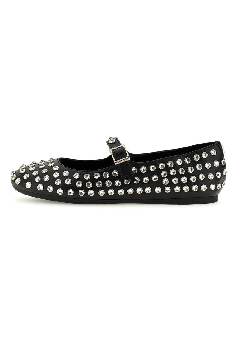 Black Mary Jane flat shoe with ankle strap, decorated with multiple silver-tone studs and rhinestones all over.