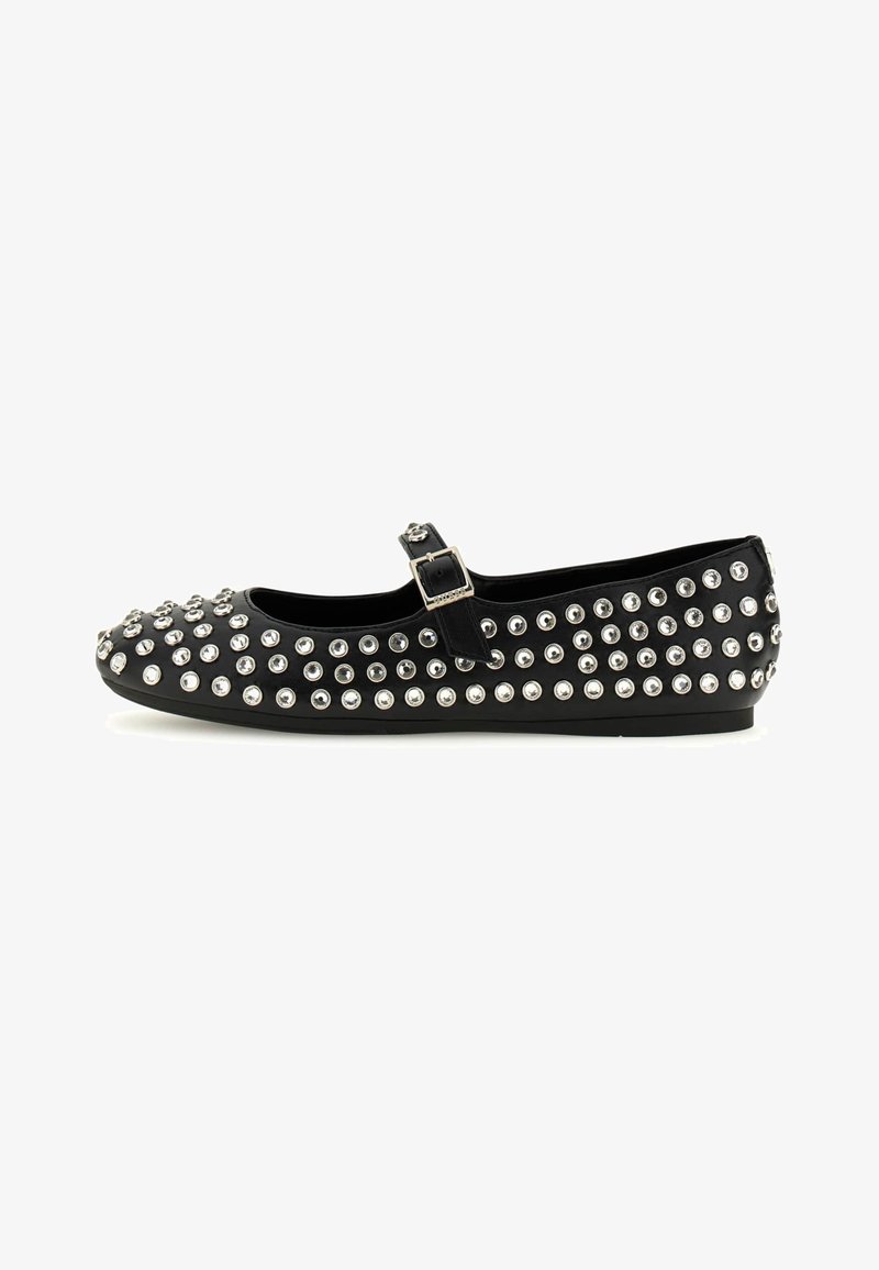 Black Mary Jane flat shoe with ankle strap, decorated with multiple silver-tone studs and rhinestones all over.