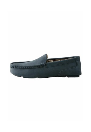 Marine slip-on sko lavet af tekstureret materiale, med en flad sål og diskret syning langs den øverste kant for detalje.